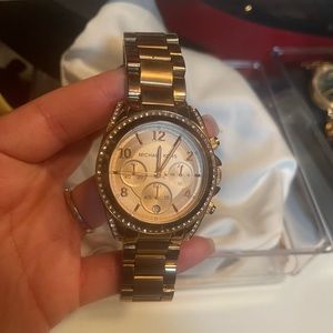 Michael Kors rose gold watch .